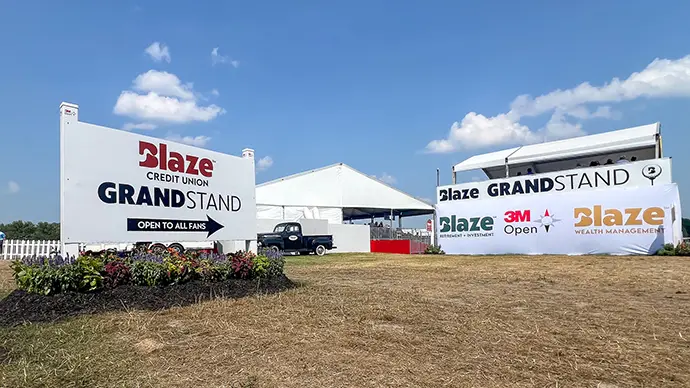 Sign with an arrow pointing to the Blaze Grandstand at the 3M Open