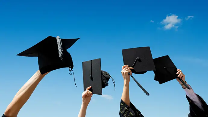 Blaze Foundation to Award $100,000 in Scholarships in 2025 Students holding up graduation caps