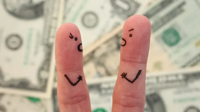 Reconciling a Spender-Saver Marriage Finger puppets arguing over money