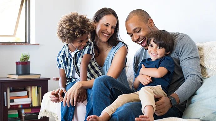 Happy family on a couch in their living room