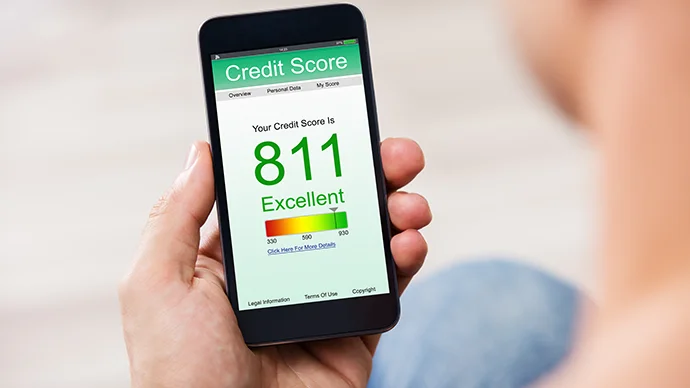 7 Ways to Protect Your Credit Score Person looking at their credit score on a mobile phone